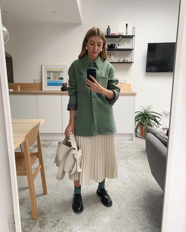 One of the Best Spring Outfits on Instagram — The green jacket, pleated skirt and oxford look got over 21,000 likes.