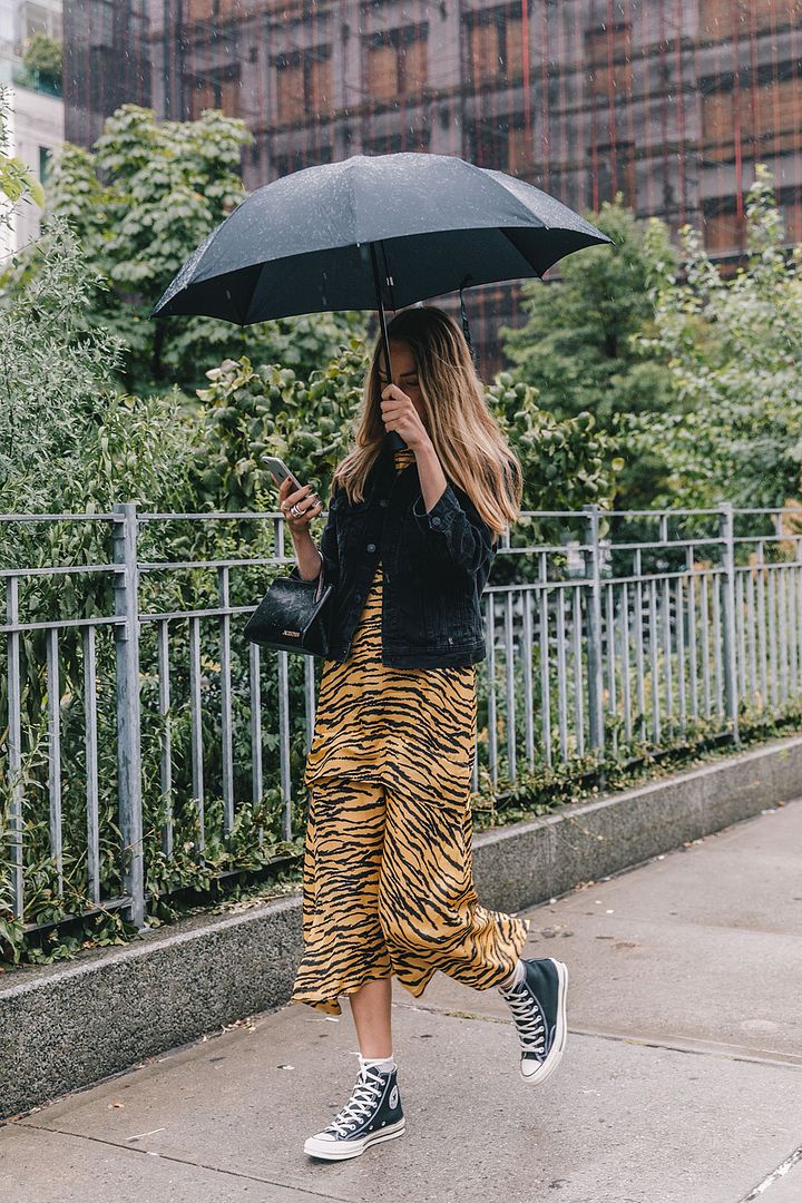 Stylish Rainy Outfit Idea — Animal Print Dress, Denim Jacket, and Converse Sneakers