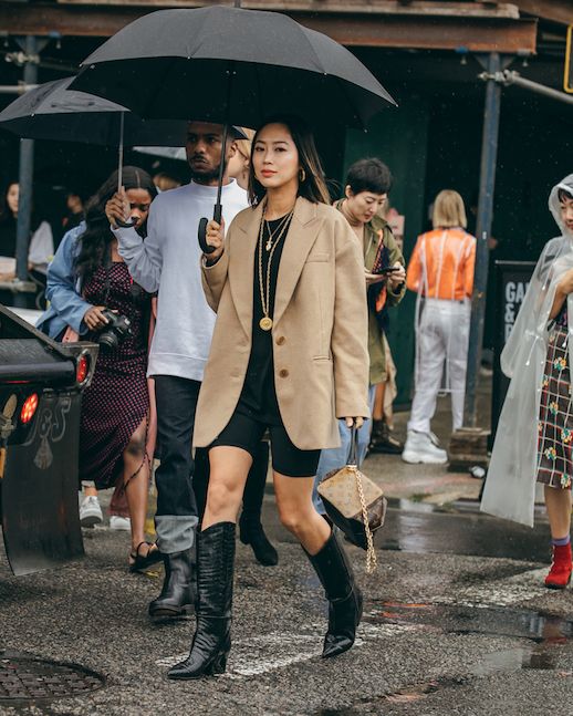 Le Fashion Blog Aimee Song Biker Short Trend Camel Blazer Black Sweater Gold Necklaces Black Cowboy Boots Via Song Of Style 