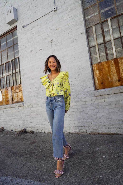 Le Fashion Blog Aimee Song Statement Floral Ruffled Yellow Blouse Straight Cropped Jeans Ruffled Velvet Heels Via Song Of Style 