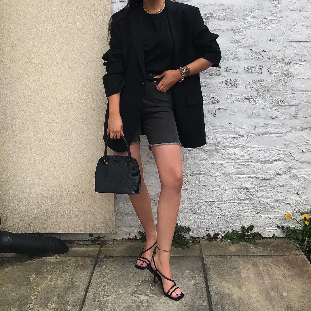 Le Fashion Blog Black Blazer Black T Shirt Mini Bag Denim Long Shorts Black Naked Sandal Shoe Trend Via Monagar Instagram