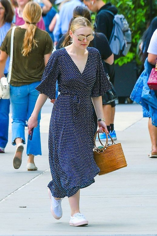 Le Fashion Blog Dakota Fanning Sunglasses Blue Polka Dotted Maxi Dress Straw Bag White Sneakers Via Harpers Bazaar 