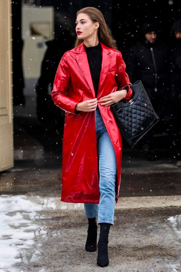 Le Fashion Blog Grace Elizabeth Off Duty Red Vinyl Coat Black Turtleneck Vintage Jeans Black Suede Boots Via Net A Porter 