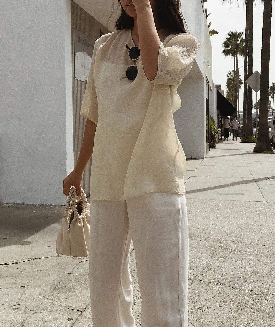 Le Fashion Blog Neutral Summer Outfit Sheer Blouse Round Sunglasses Cream Trousers Via Jordanrisa Instagram