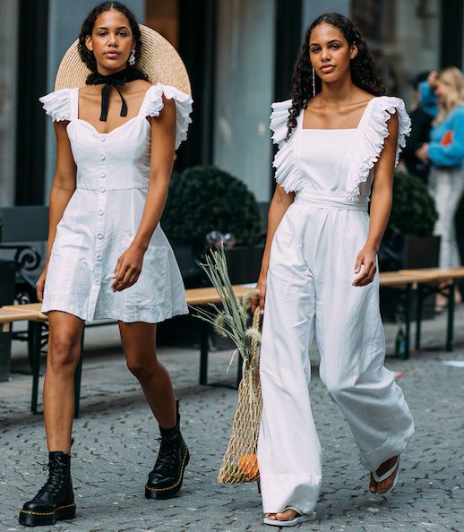 Le Fashion Blog Oslo Fashion Week Chioko Johansen Twins White Ruffle Mini Dress Combat Boots White Ruffle Jumpsuit Fishnet Bag Flip Flops Trends Via Style Du Monde 