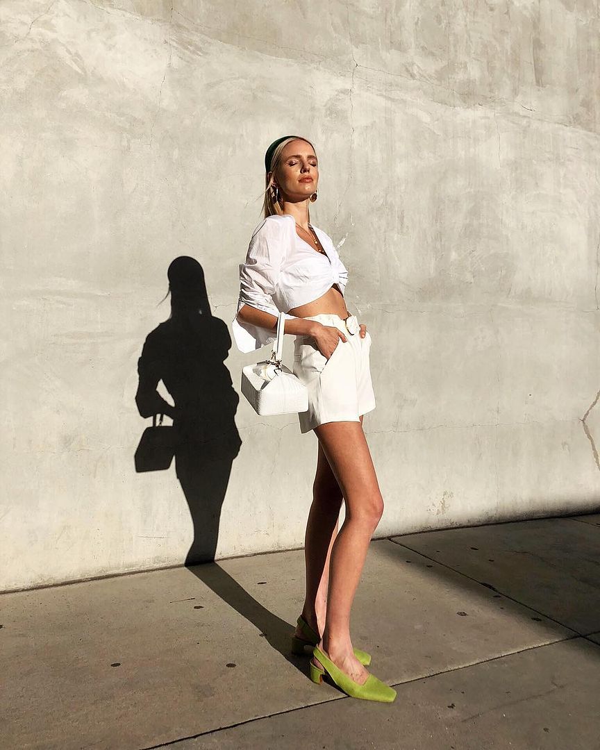 Le Fashion Blog Summer Outfit Black Headband White Cropped Shirt White Tie Waist Shorts Green Suede Heels Via Leoniehanne Instagram