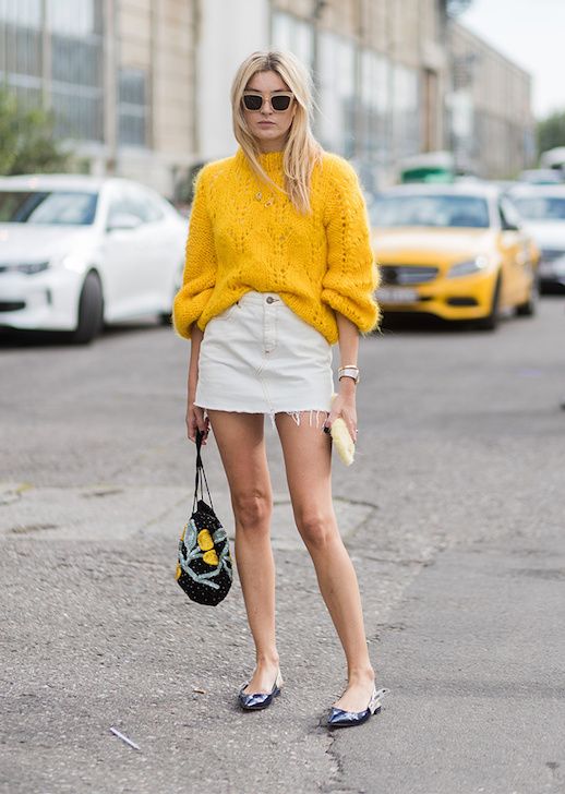 Transitional Fall Outfit Inspiration — Camille Charrière, yellow sweater, white denim skirt 