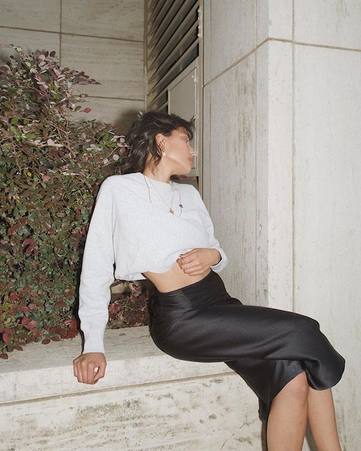 Le Fashion Blog White Cropped Sweatshirt Gold Necklaces Black Midi Silk Skirt Via @Discodaydream 