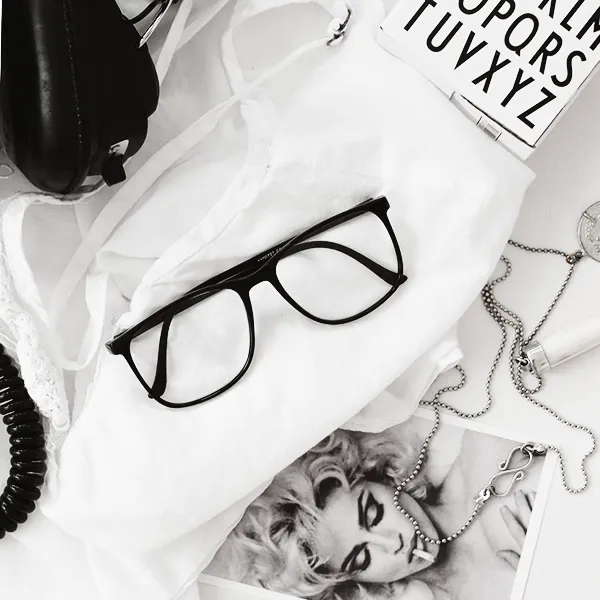 LE FASHION BLOG HOME DECOR INSPIRATION MIJA THE SUPER ORDINARY SWEDISH INTERIOR DESIGN BLOGGER BLACK AND WHITE FASHION RELATED DETAILS NECKLACE MADONNA NECKLACE BLACK FRAMES EYEGLASSES WHITE TEE 2 photo LEFASHIONBLOGHOMEDECORINSPIRATIONMIJATHESUPERORDINARY2.jpg