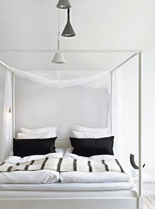 Le Fashion Blog A Fashionable Home Neutral Chic In Malmo Sweden Nina Bergsten Via Residence Bedroom Canopy Bed Black And White Pillows Stripe Throw Blank Quilt Comforter White and Grey Hanging Light Pendants 7 photo Le-Fashion-Blog-A-Fashionable-Home-Neutral-Chic-In-Malmo-Sweden-Nina-Bergsten-Via-Residence-Bedroom-7.jpg