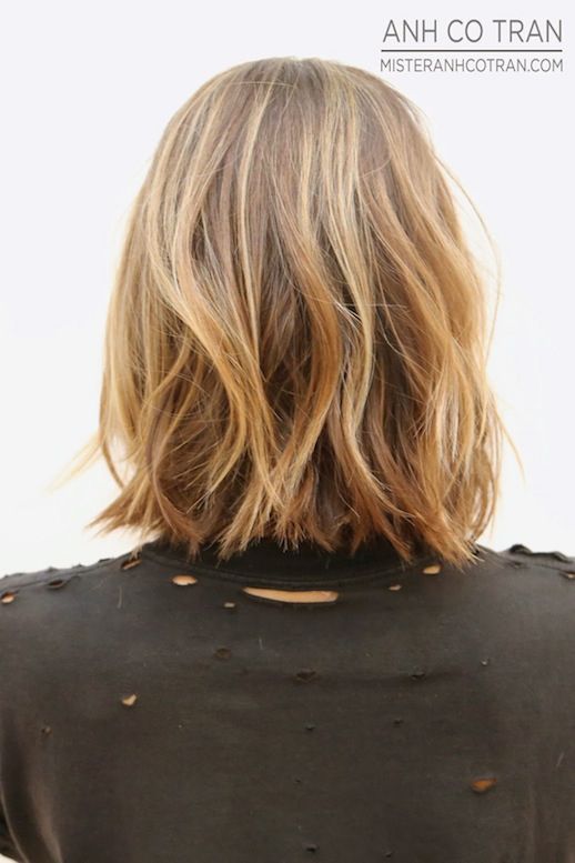 Le Fashion Blog Haircut Inspiration The Perfect Wavy Bob Via Mister Anh Co Tran Back Texturized Beach Waves Highlights Balayage Bright Beauty Red Lipstick Destroyed Distressed Black Tee Tshirt Summer Haircut 3