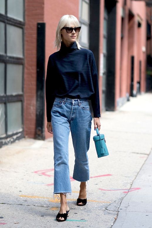Le Fashion Blog Fall Street Style Nyfw Blonde Cat Eye Sunglasses Turtleneck Sweater Raw Hem Jeans Mini Blue Bag Via Style Caster