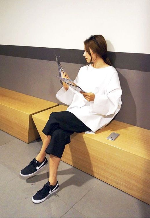 Le Fashion Blog Sporty Style Ponytail White Top With Wide Sleeves Cropped Black Trousers Nike Sneakers Via Stylenanda